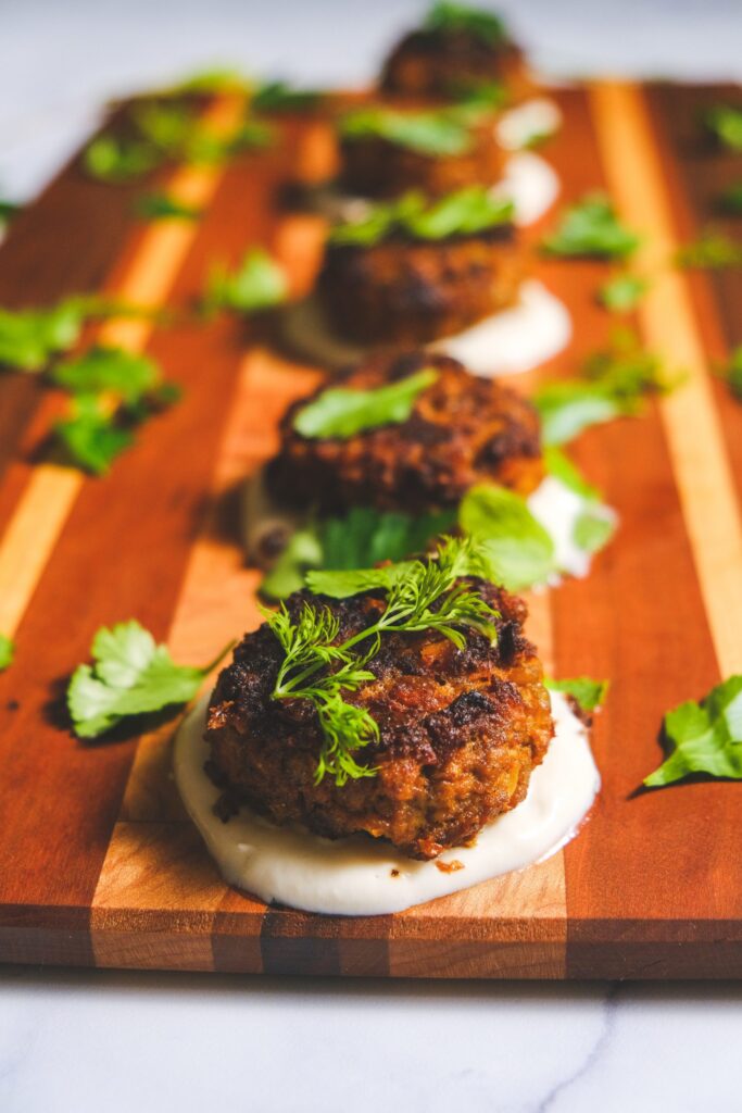 Middle-Eastern Lamb and Lentil Meatballs Salted Tahini Yogurt Pickled Cucumbers and Herbs