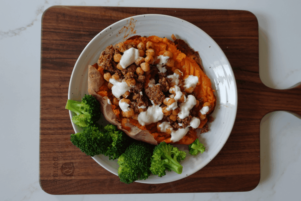 Taco-Stuffed Sweet Potato with Crispy Chickpeas & Sriracha Yogurt Sauce